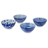 Four blue ceramic bowls with intricate floral and geometric patterns, set against a white background.