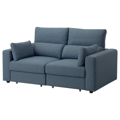 A blue fabric sofa named ESKILSTUNA with a high back and adjustable headrests.