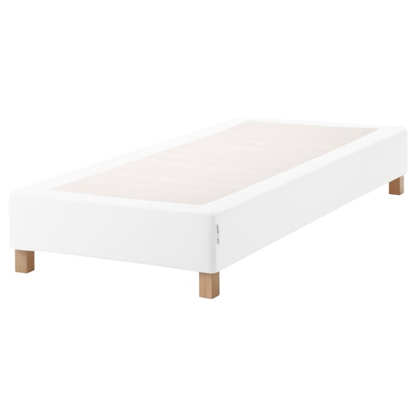 A white ESPEVÄR bed base with wooden legs. It lifts mattresses, supports shape, and has removable cover.