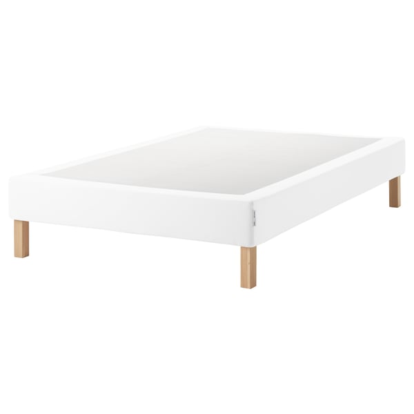A white ESPEVÄR bed frame with wooden legs. Its simple, modern, and sturdy, designed to raise beds and support mattresses.