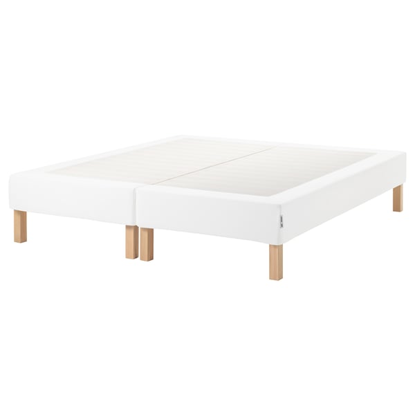 A white ESPEVÄR bed base with wooden legs, designed for support and easy cleaning.