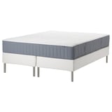 Blue and white mattresses on white metal legs.