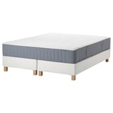 IKEA mattress in white & blue, rectangular, on white base with wooden legs.