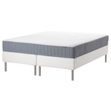Modern white bed frame with gray mattress, stainless steel legs, minimalist design.