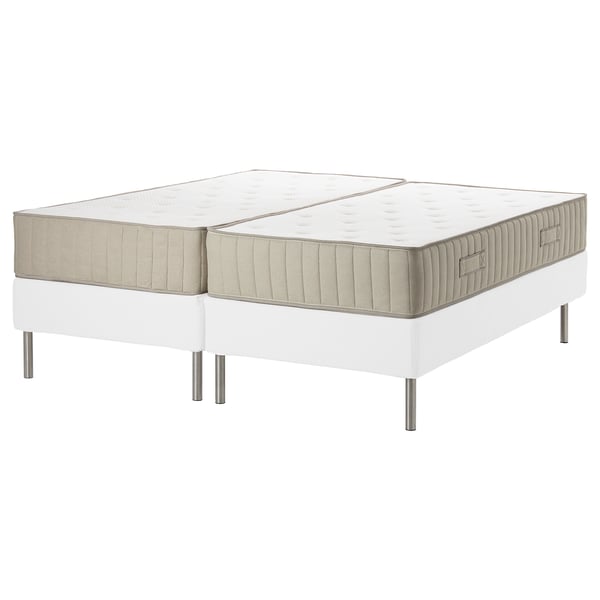 White twin mattress and bed frame set with minimalist design, stainless steel legs, and beige trim.