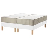 The ESPEVÄR/VATNESTRÖM bed base and mattresses. Its white with wooden legs, featuring a clean and modern design.