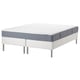 Option: An ESPEVÄR/VESTERÖY bed with a gray and white mattress on a white metal frame.