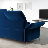 Blue FAMMARP sofa with adjustable head & armrests, modern design. Its large, fitting well in spacious living rooms.