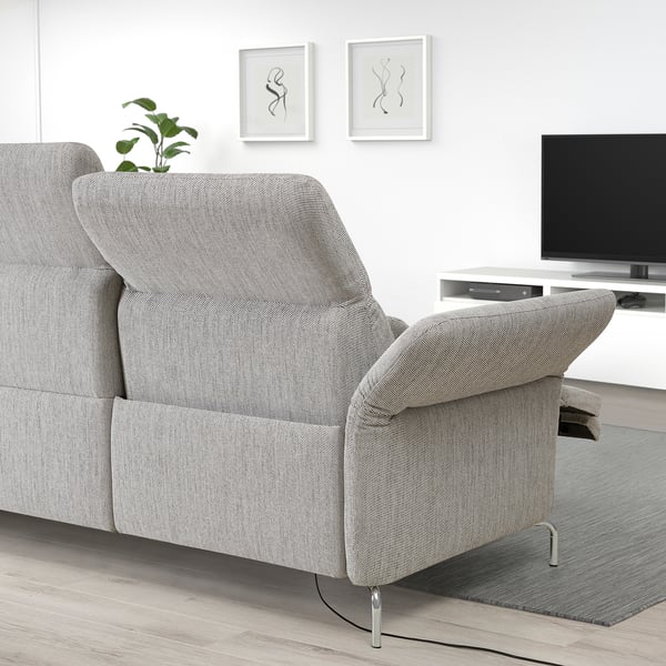Modern living room with FAMMARP light grey sofa. Adjustable headrests and arms, sleek design, metal legs.