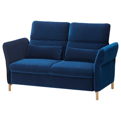 Blue velvet FAMMARP sofa with adjustable pillows and wooden legs.