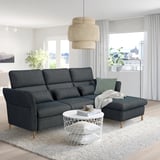 Modern living room with FAMMARP sofa, adjustable head and armrests. White coffee table and round lamp create cozy, stylish space.