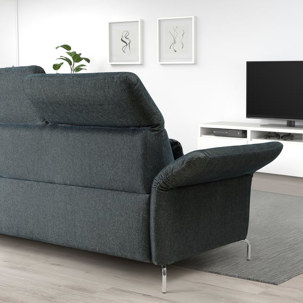Modern living room with black FAMMARP sofa; comfortable, adjustable, icy grey rug, tv stand, and decorative art.