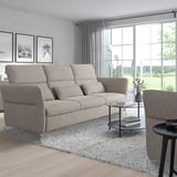 Modern living room with FAMMARP sofa, rug, coffee table, large window, ample seating.