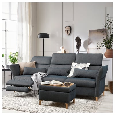A modern gray FAMMARP sofa set with adjustable headrests and a matching ottoman in a stylish living room.