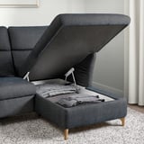 Modern sofa with lift-up seat for storage, adjustable headrests, and wooden legs.