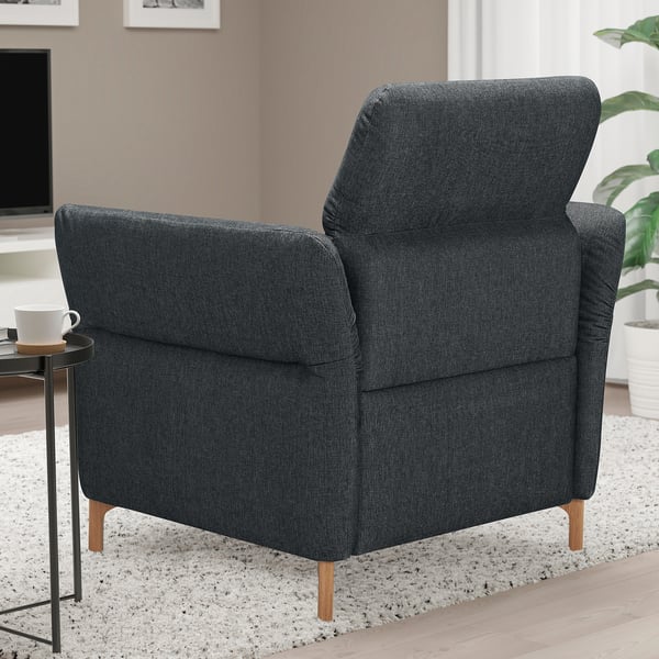 Gray FAMMARP armchair, plush, wide, with handy side table. Soft fabric, cozy, & comfy.