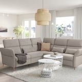 Modern living room with spacious gray FAMMARP sofa, stylish pendant light, sleek coffee table, and large window.