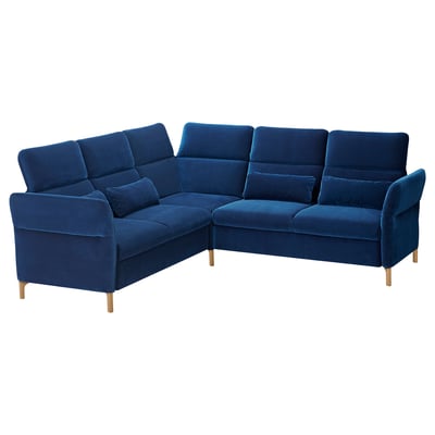 Blue FAMMARP corner sofa. Velvet upholstery, wooden legs, adjustable sections.