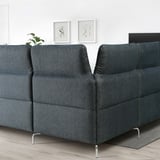 FAMMARP sectional sofa, dark blue, adjustable headrests, modern design, metal legs, white wall, abstract art.