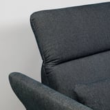 Close-up of FAMMARP sofas armrest showcasing smooth fabric, comfortable cushioning, and sleek design.