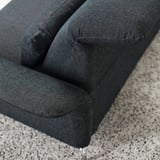 Close-up of dark grey FAMMARP sofa, showcasing plush, inviting cushions and meticulous stitching, emphasizing comfort and quality.