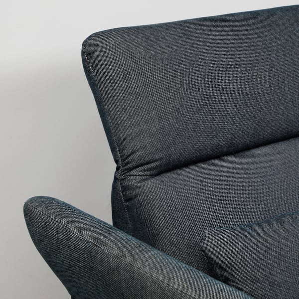 Close-up of modern sofas armrest, upholstered in textured, grey fabric, showcasing high-quality stitching and comfortable design.