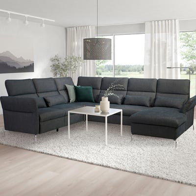 Modern living room with FAMMARP sectional sofa, pillows, coffee table, window.