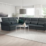 L-shape FAMMARP sofa, coffee table, large windows, area rug.