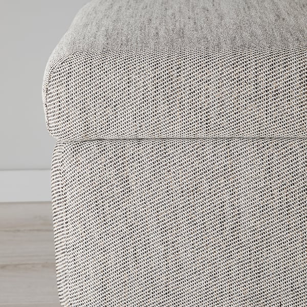 Close-up of a grey FAMMARP footstool, showing its cozy, woven fabric texture and sturdy stitching.