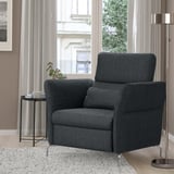 Dark gray FAMMARP recliner near window. Comfortable, high resilience foam, chic design. Smaller than side lamp, larger than plant.