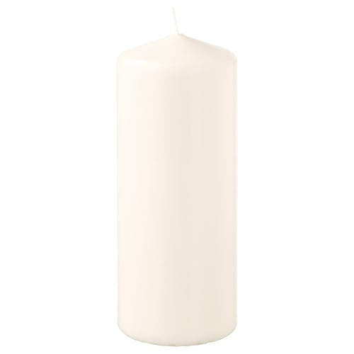 FENOMEN white pillar candle, elegant and simple, made from plant-based and paraffin wax, standing upright.