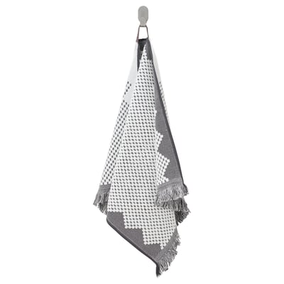 A FJÄLLSTARR towel in blue & white. The pattern is bohemian with fringe. Its woven from cotton and hangs on a hook.