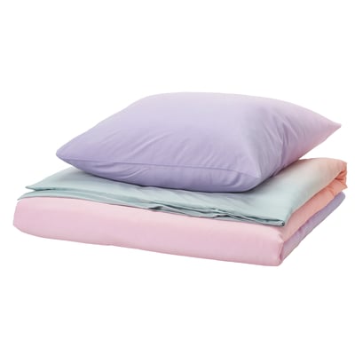 FLÄDERBUSKE bedding set: pastel purple pillow atop pink and light blue sheets, rectangular shape, shifting shades design.