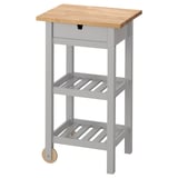 Grey FÖRHÖJA trolley with wooden top, wheels, drawer, two shelves.
