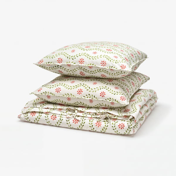 Floral-patterned bedding set with light colours and green, red, and white flowers. Crafted from 100% cotton. Soft and breathable.