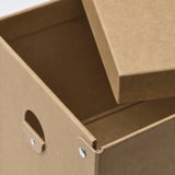 Recycled cardboard box with handle and lid.