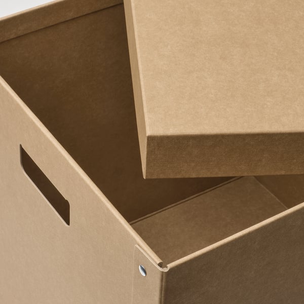 Open cardboard box with handles, showing sturdy, recycled material.