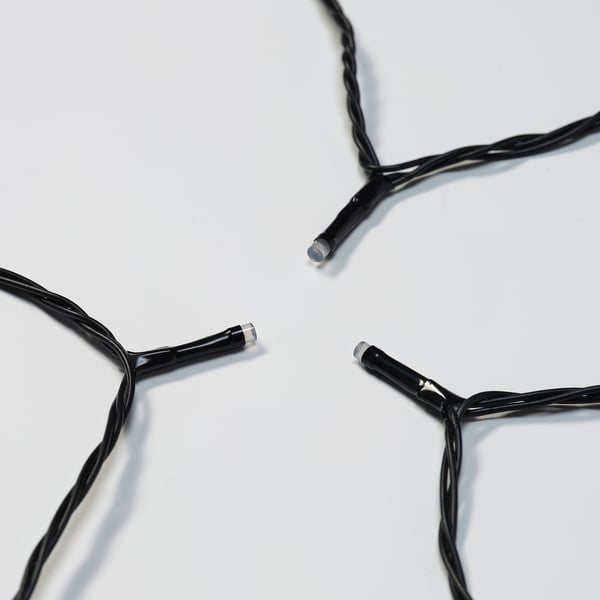 Image shows high-quality black led string lights with multiple bulbs connected, designed for outdoor use, lying on a white surface.