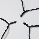 Image shows high-quality black led string lights with multiple bulbs connected, designed for outdoor use, lying on a white surface.