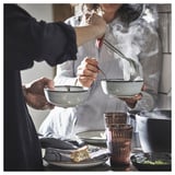 Serving soup into GLADELIG bowls.
