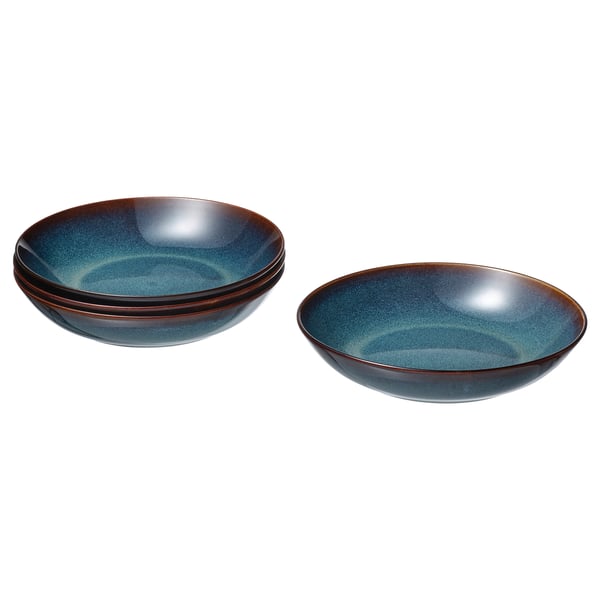 Two sets of deep, ocean-blue glazed stoneware plates with golden-brown details, stacked neatly, showcasing their classic round shape and crafted look.