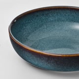 Blue-green glazed dish with gold trim.