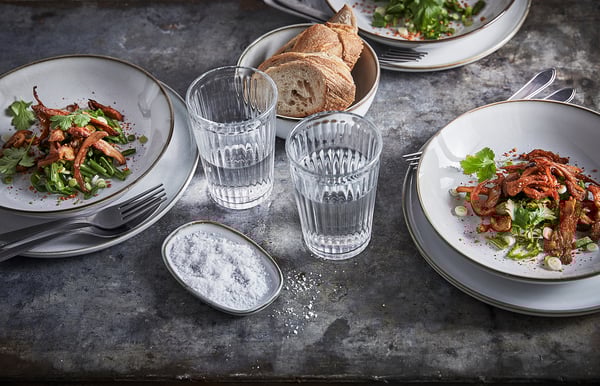 White GLADELIG tableware set with food and utensils.