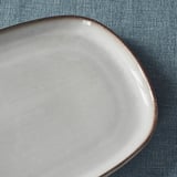 Gray plate on cloth.