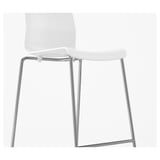 Modern white bar stool with sleek chrome legs, designed for comfort and stackability.
