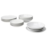 Set of white stoneware plates and bowls, simple and stylish design for everyday use.