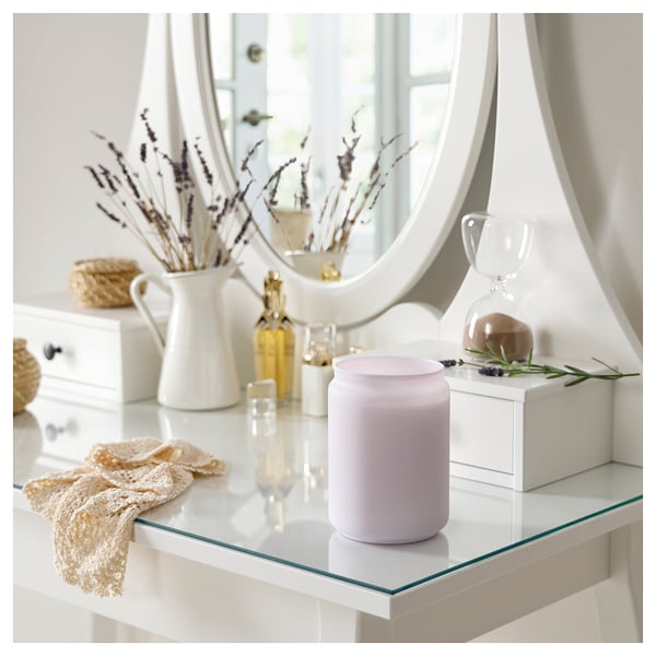 Lavender candle on glass table with decor