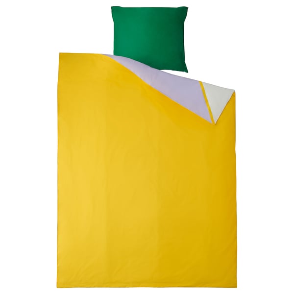 Bright yellow bed cover with colorful triangle design, green pillow, 100% cotton.