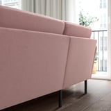 Light pink GRILLSTORP 4-seat sofa with sleek design, angled legs, and cozy cushions.
