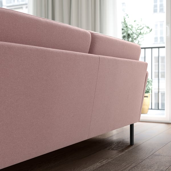 The GRILLSTORP sofa in pink plush cushions and high legs for easy cleaning. Its modern design fits well in spacious rooms.